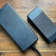 The standard pack-in power supply is on the right, while the Boost Kit 180 is on the left.